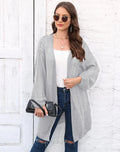 Women's loose-fit acrylic sweater coat in army green, shown on a hanger.