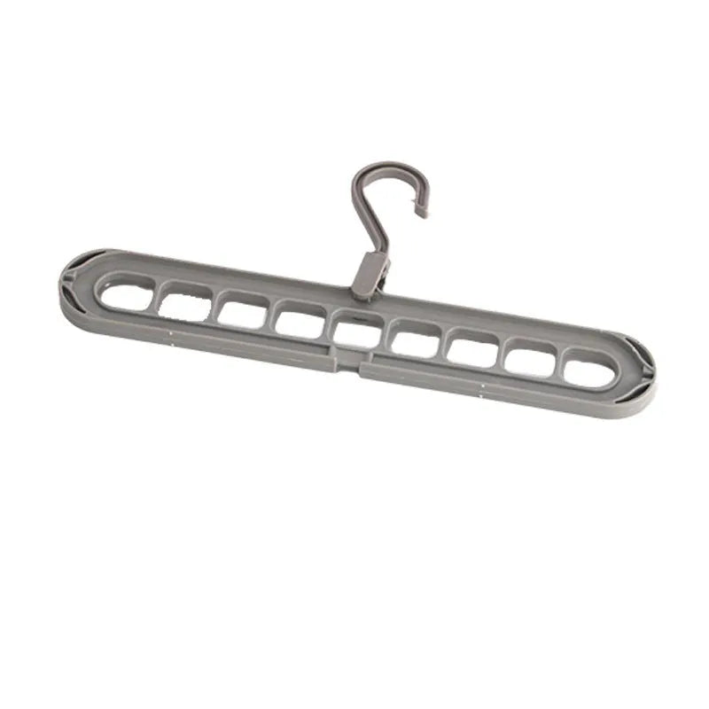 Multifunctional plastic hanger with nine holes for folding trousers, shown in beige