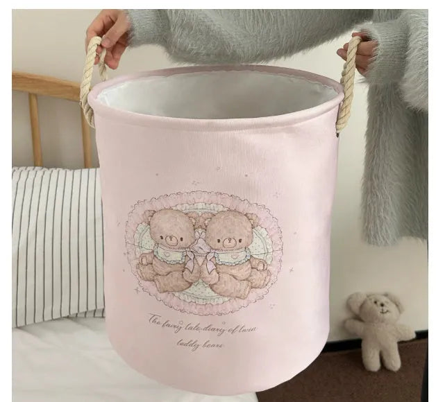 Foldable cotton cloth laundry basket in a character print colour, shown unfolded for use.
