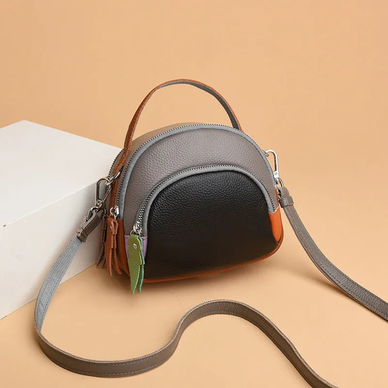 Hand-held crossbody first layer cowhide leather single-shoulder bag in soft round shape with sewing line detail