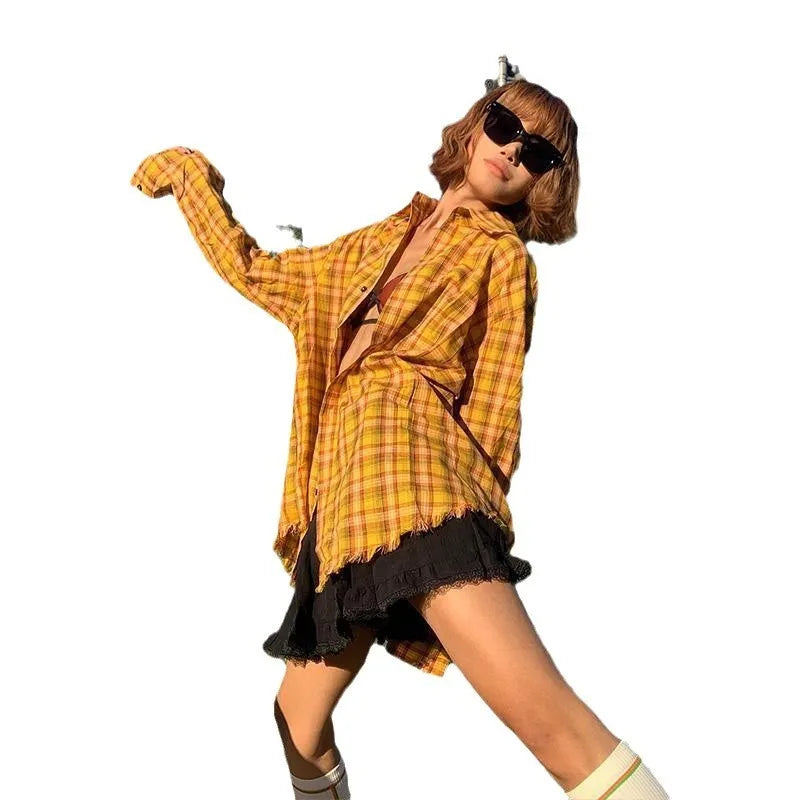 A loose-fit yellow plaid cardigan shirt for men and women, shown on a hanger.