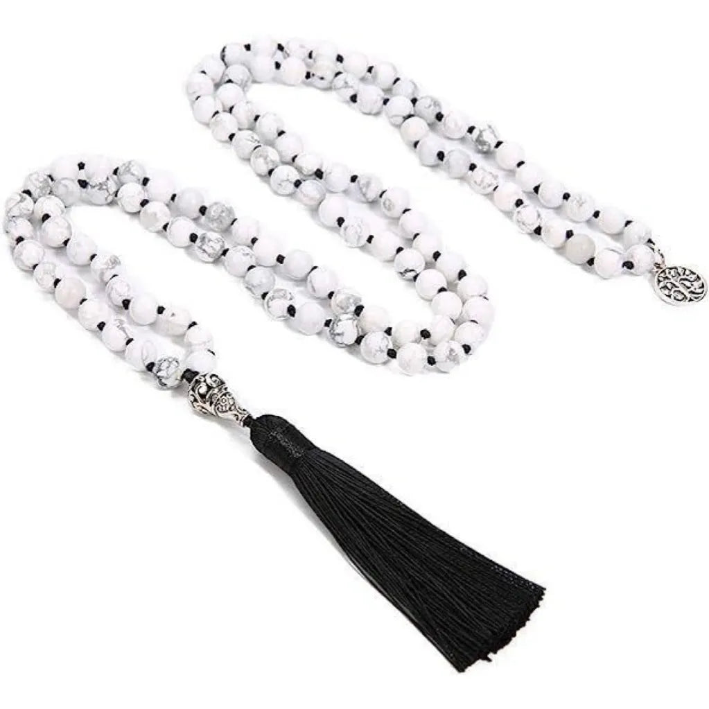 Long handmade necklace with 108 small round stone beads on a black cord, shown doubled up.
