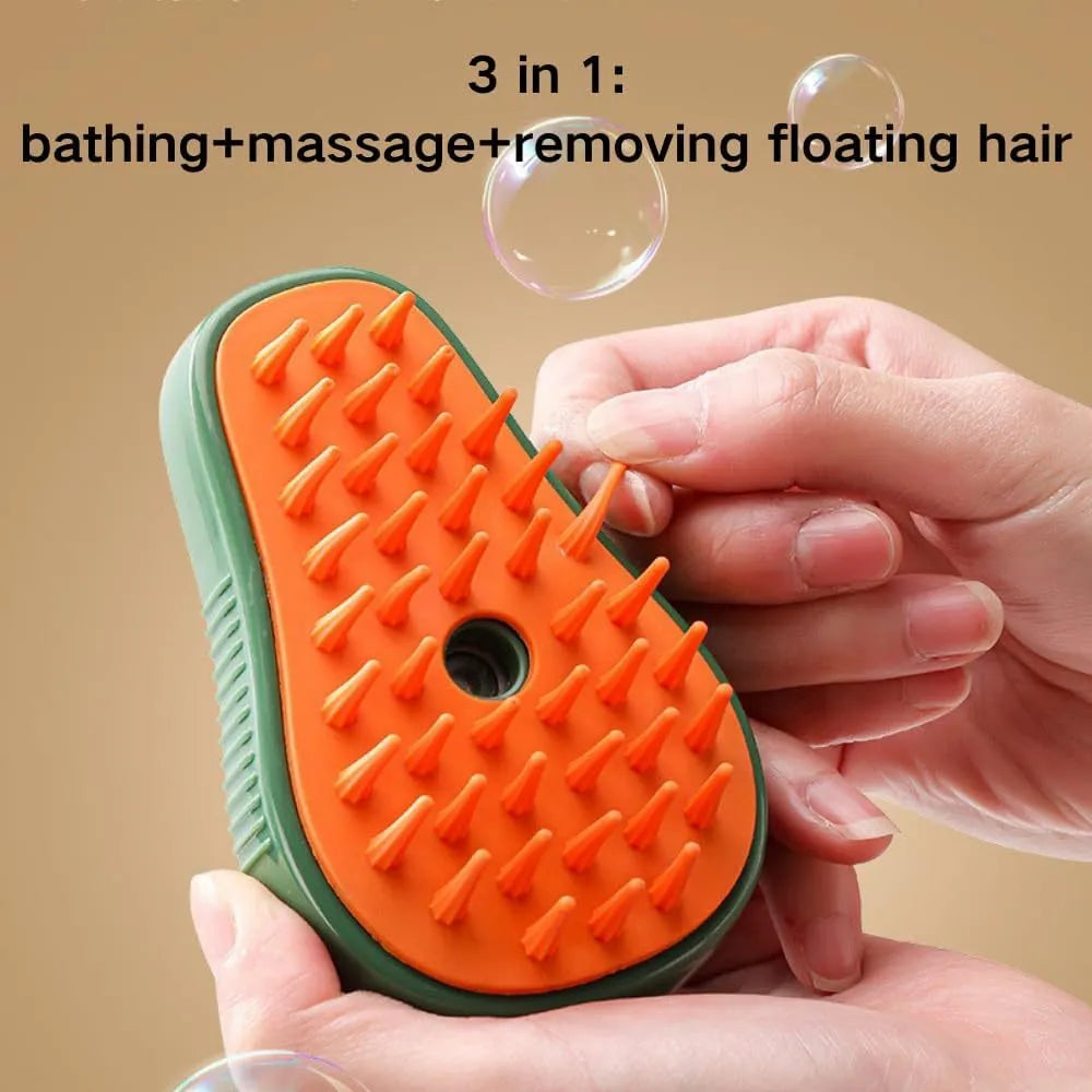 Green and white 3-in-1 cat steam brush with water spray and soft silicone teeth for pet grooming.