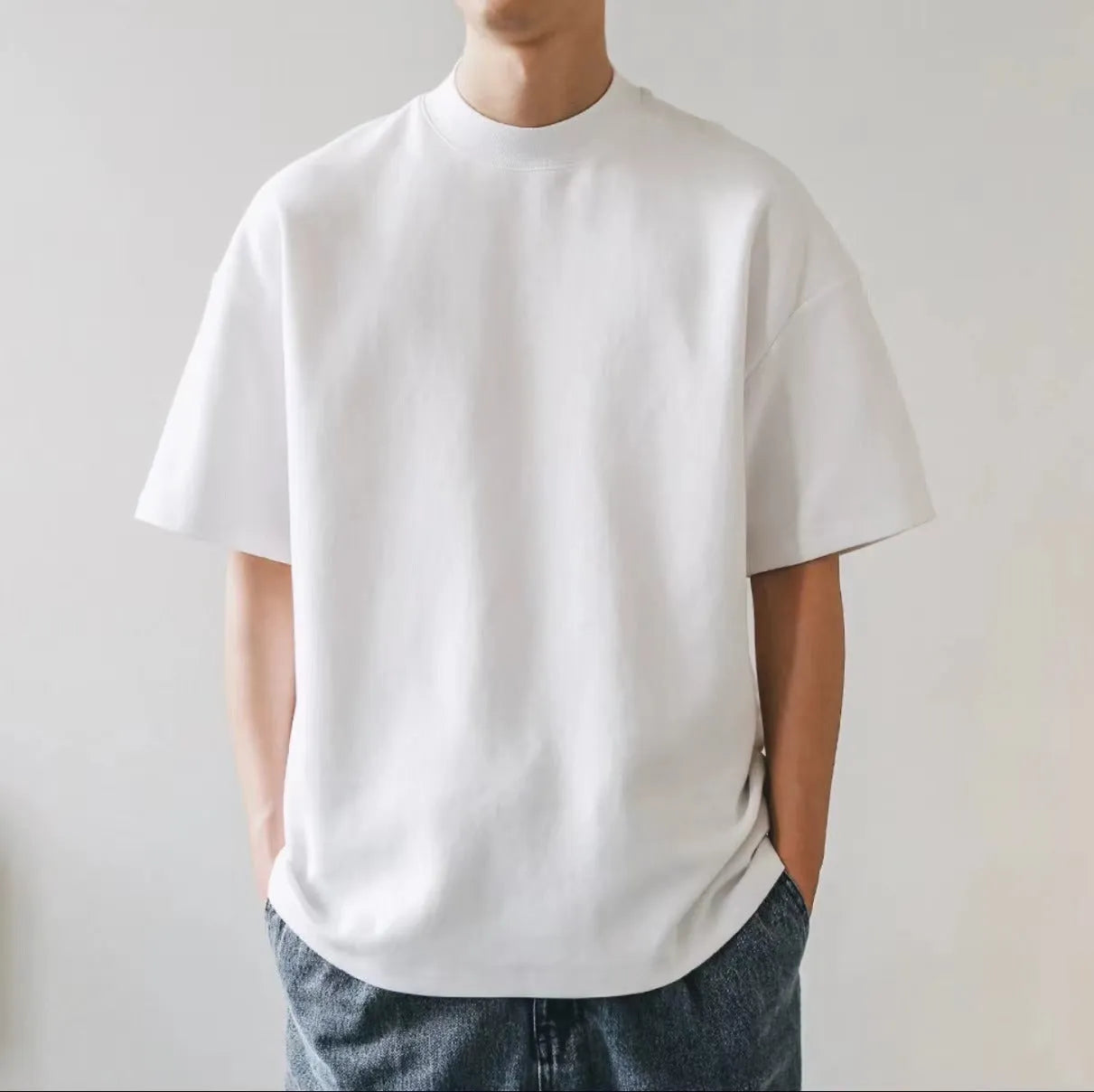 Plus size men's oversized solid colour cotton T-shirt in Ivory White with loose fit and short sleeves