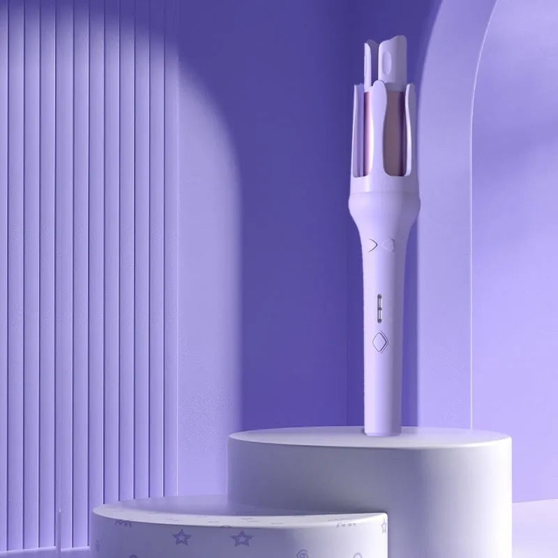 White and pink automatic hair curler with a 32mm ceramic barrel and a US plug adapter on a table.