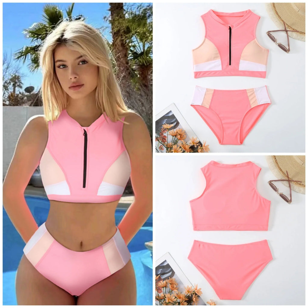 Pink high-waist bikini swimsuit with split shorts on a neutral background.