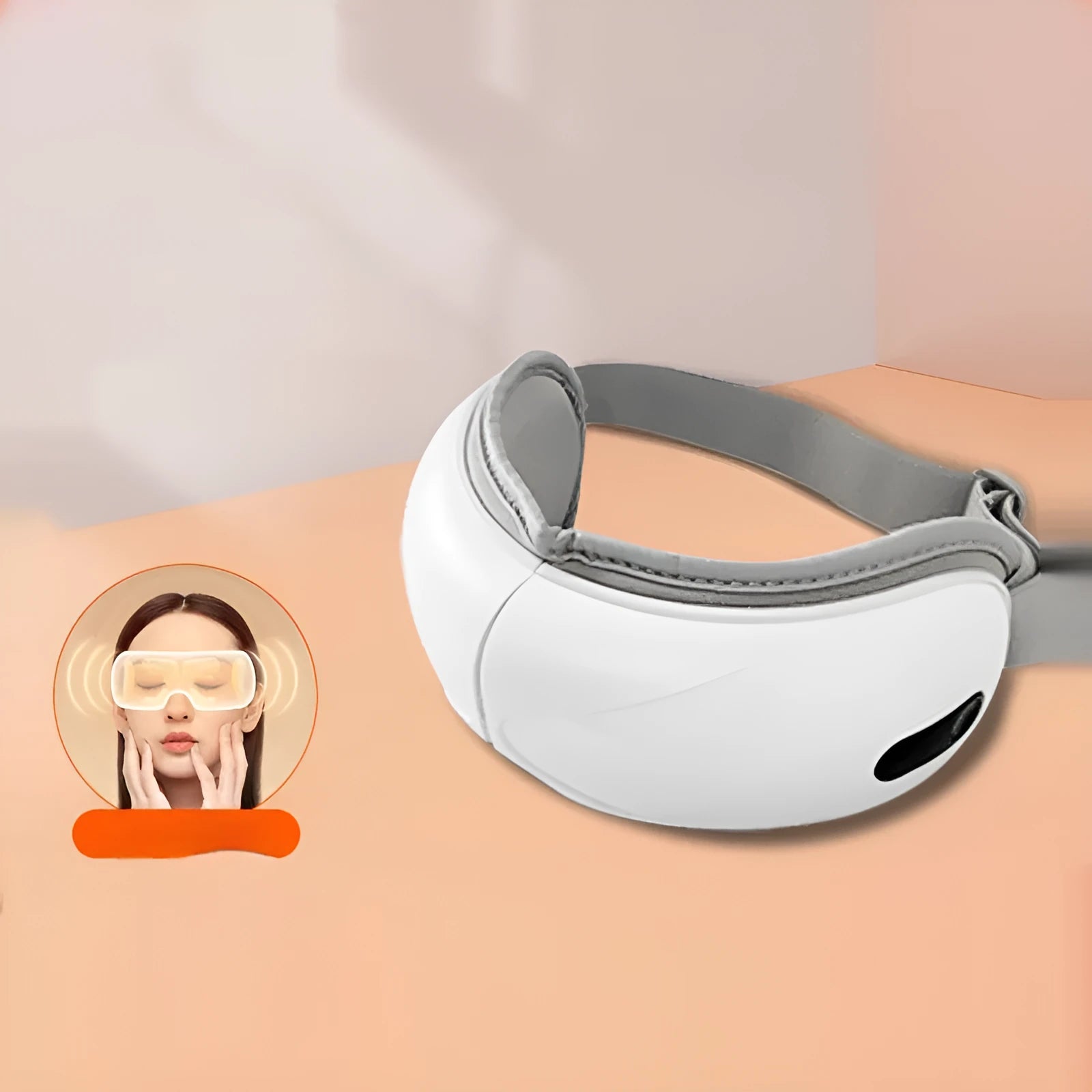 White rechargeable eye massager with hot compress and airbag functions on a table