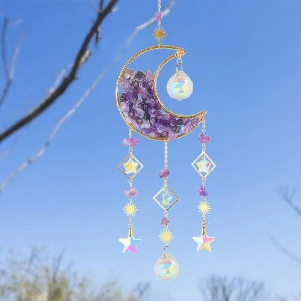 K9 crystal moon-shaped car pendant hanging, showing reflective surface and colour options.
