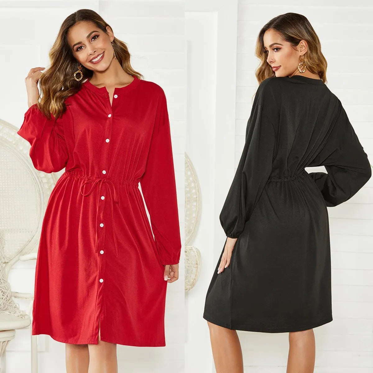 Women's black A-line midi dress with elastic cuffs and a waist cinching belt.