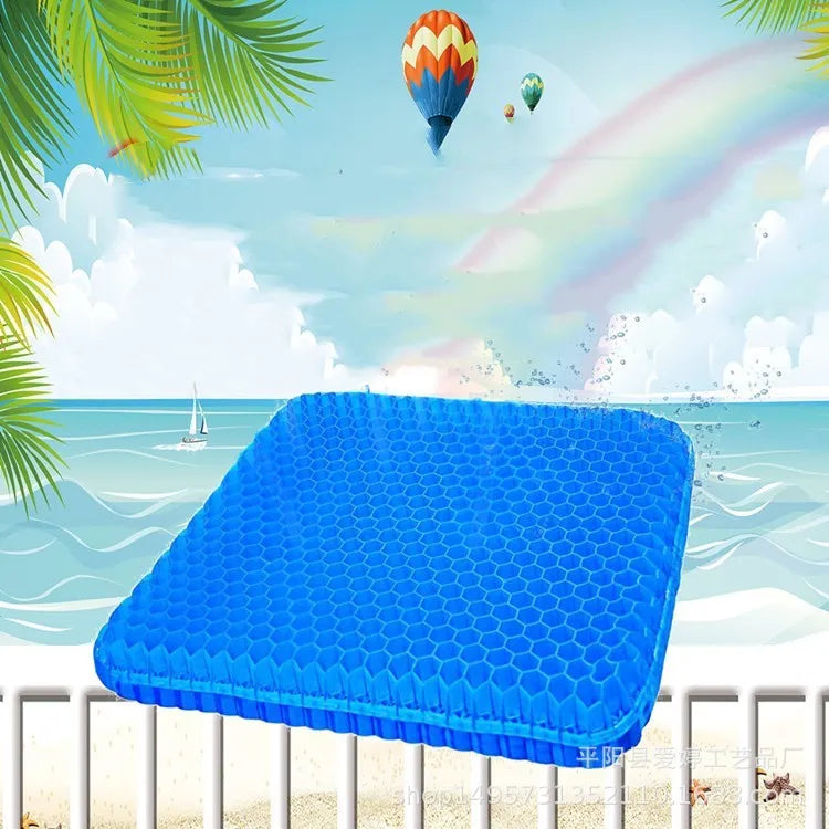 Grey gel seat cushion with honeycomb design for tailbone pain relief, shown on a car seat.