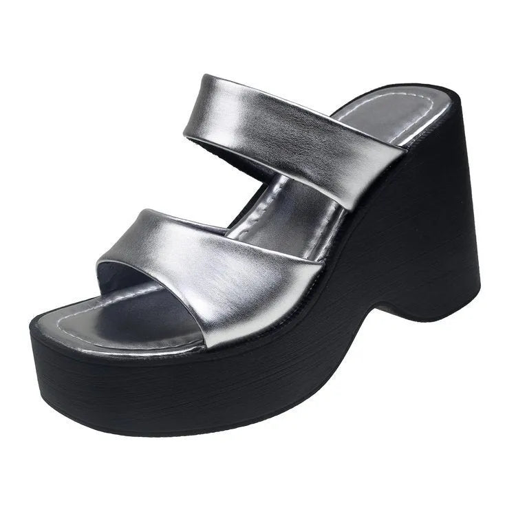 Women's black wedge platform slippers with a square toe, shown from the side.