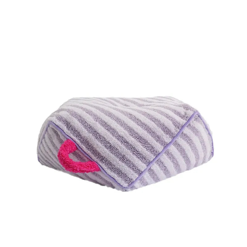 Striped orange soft velvet pet bed for dogs with a removable washable cover.