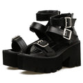 Black women's punk style platform sandals with chunky heel, round toe, buckle straps, and a rear zipper.