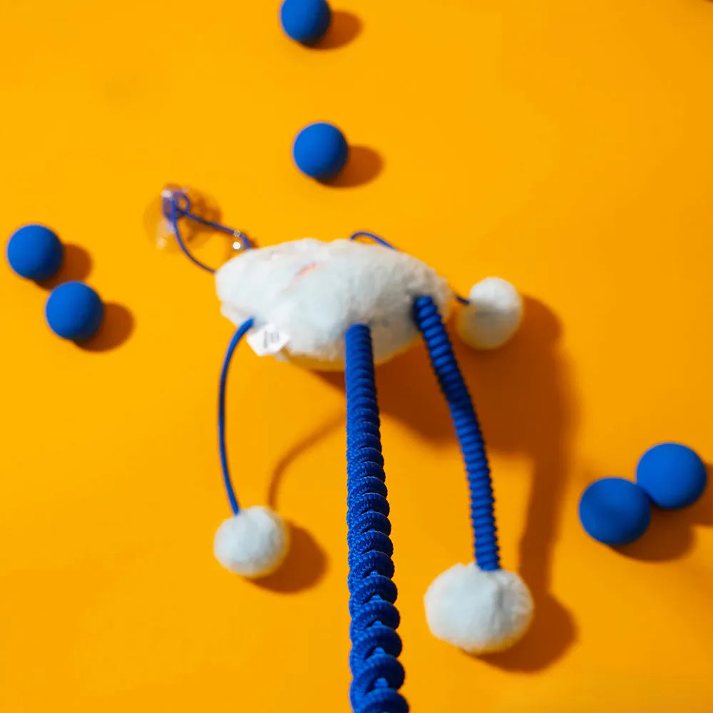 Blue telescopic elastic rope cat toy with plush and bell attachments on a white background.