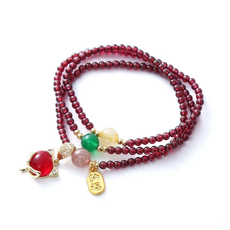 Purplish red garnet crystal fox bracelet with adjustable rope fastening for women