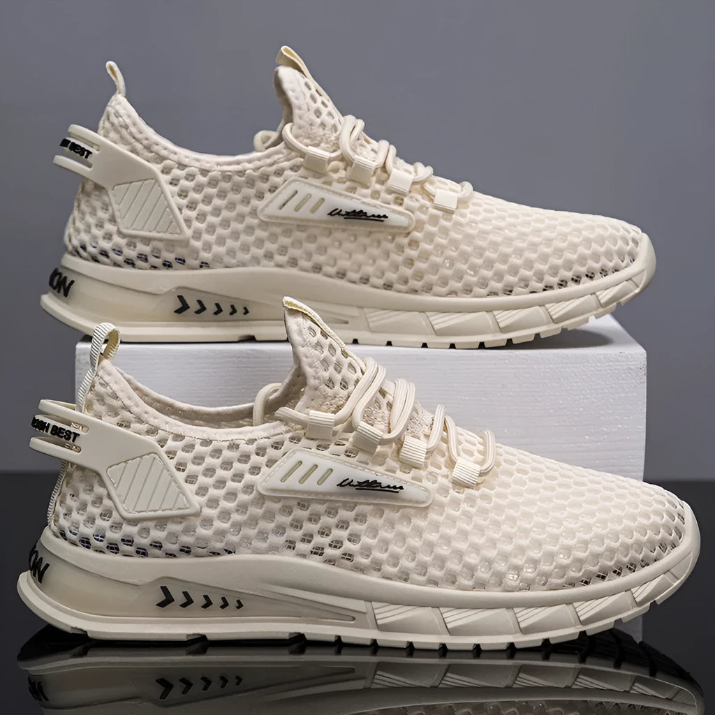 Men's beige mesh sneakers with lace-up front and synthetic leather upper on a white background.