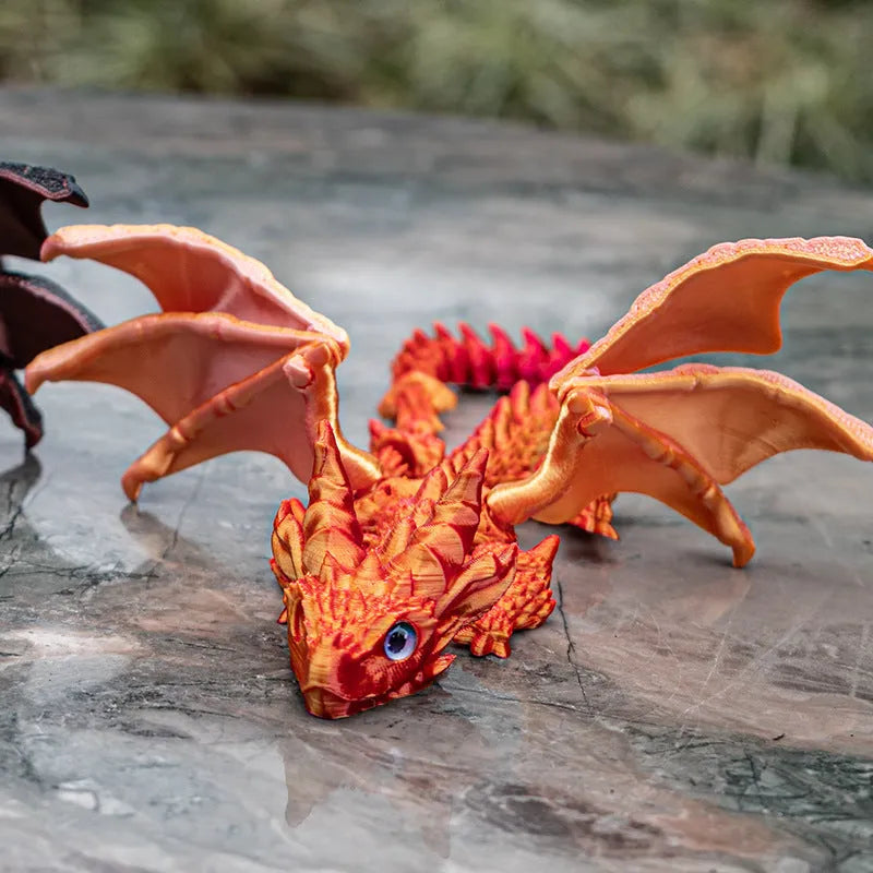Red and gold PLA flying dragon wings decoration toy measuring 25cm wide.