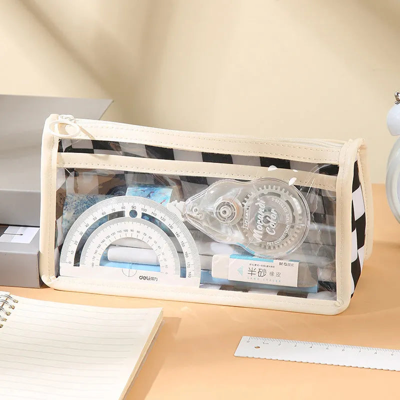 Transparent PVC pencil case with a chessboard pattern, showing pens inside.