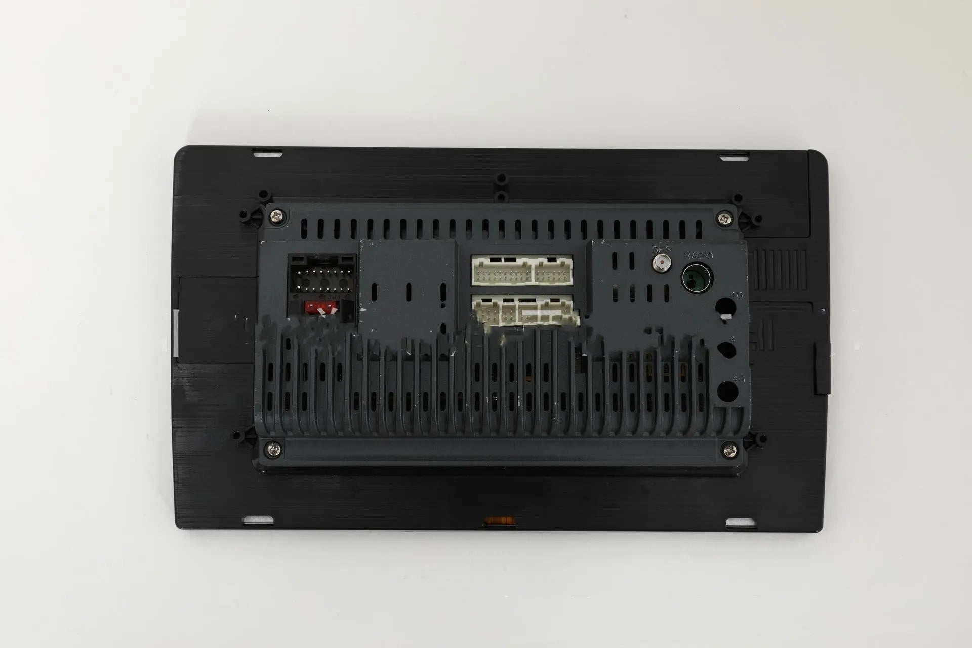 10.1 inch universal Android car head unit with trapezoidal touch screen display and connection ports