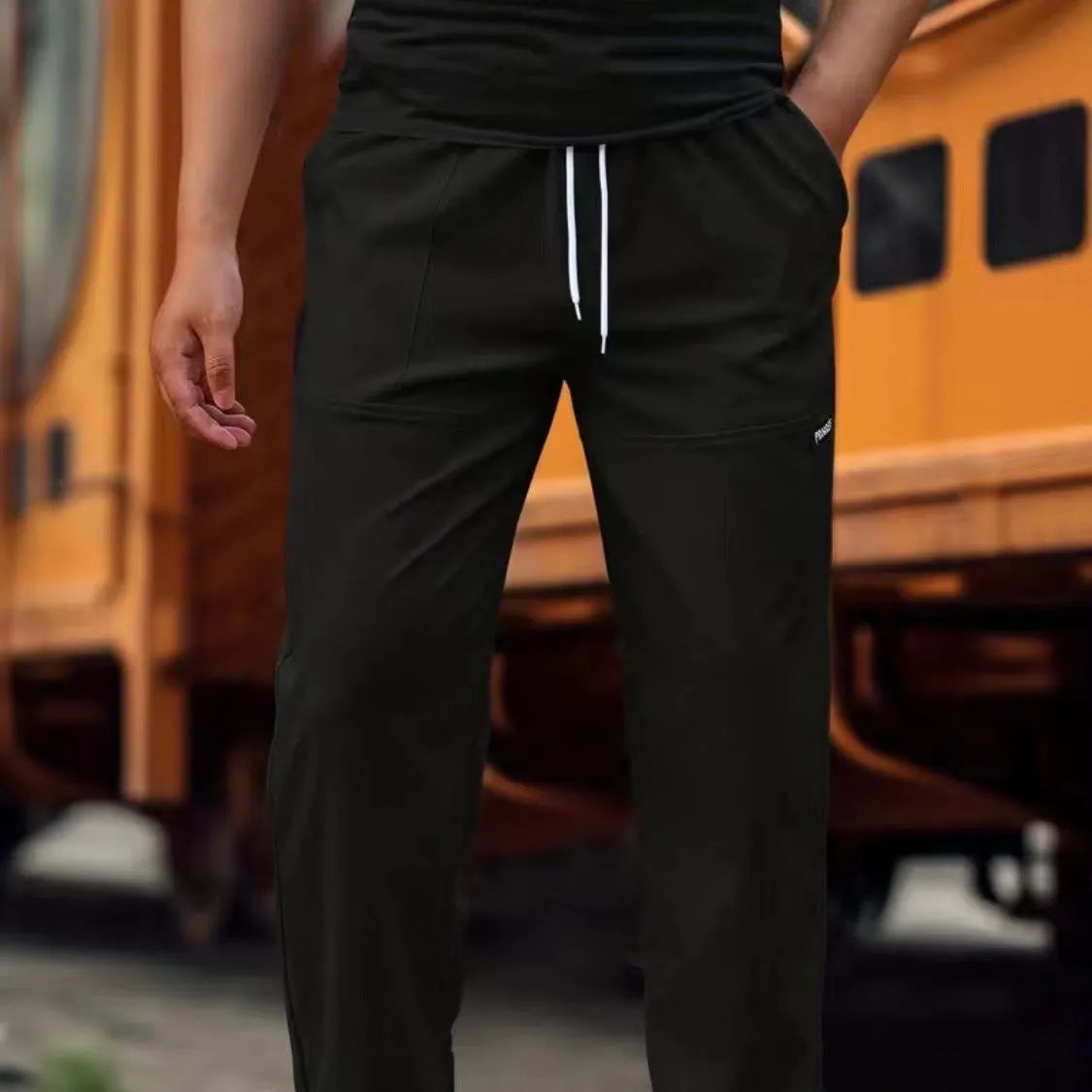 Men's light grey polyester casual trousers for spring and autumn wear.