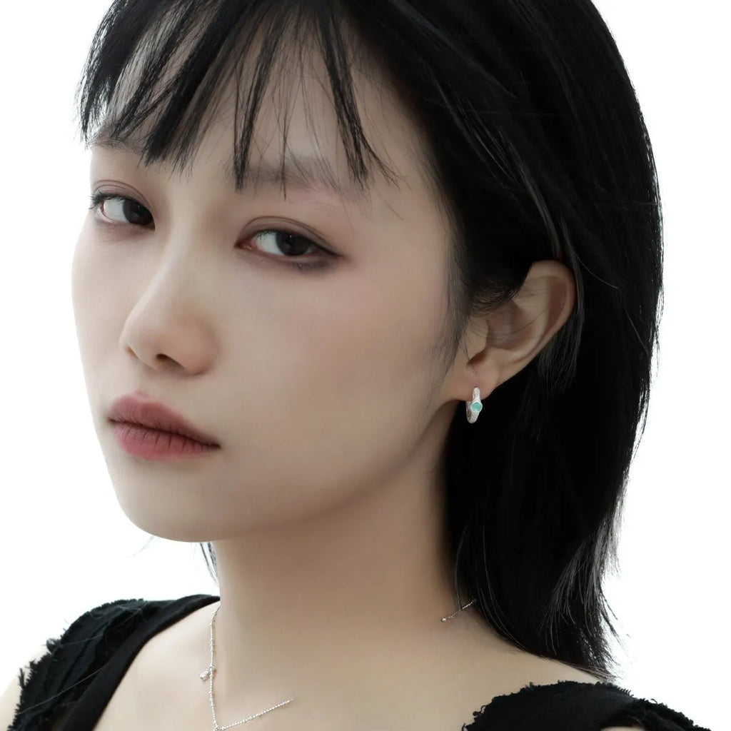 Geometric circle ear clip in burnt silver finish made from 925 sterling silver