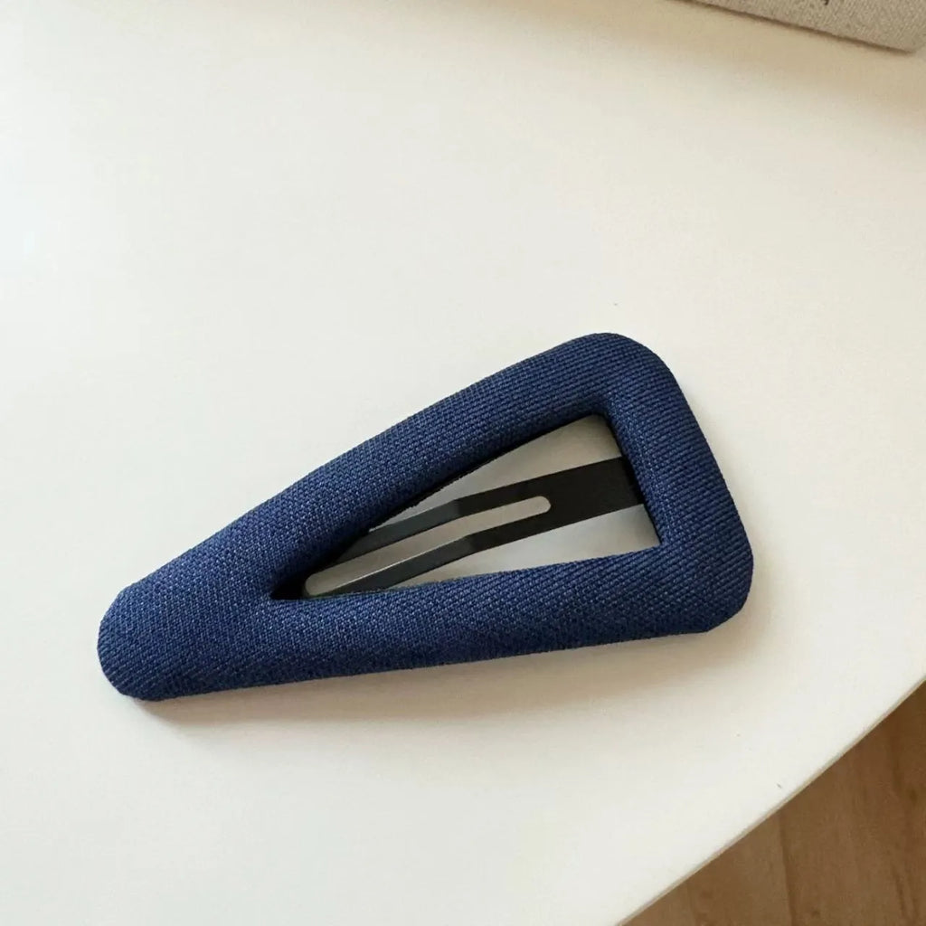 Retro style hair barrettes in dark denim and polka dot patterns, showing triangle and water drop shapes.