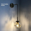 Modern glass wall lamp with metallic finish in Golden Flower or Silver Flower, 15cm or 20cm diameter