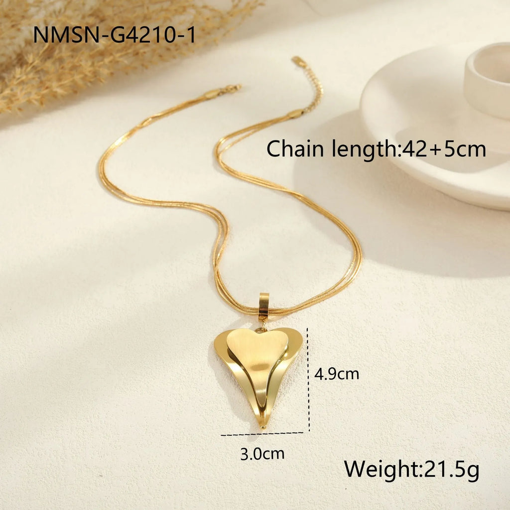 Geometric double heart pendant on a textured snake bones chain necklace in stainless steel.