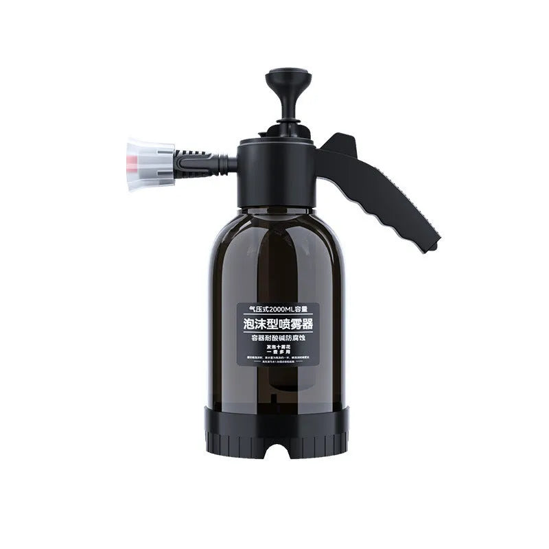 Black handheld 2L foam watering can sprayer with two nozzles and a comfort-grip handle.