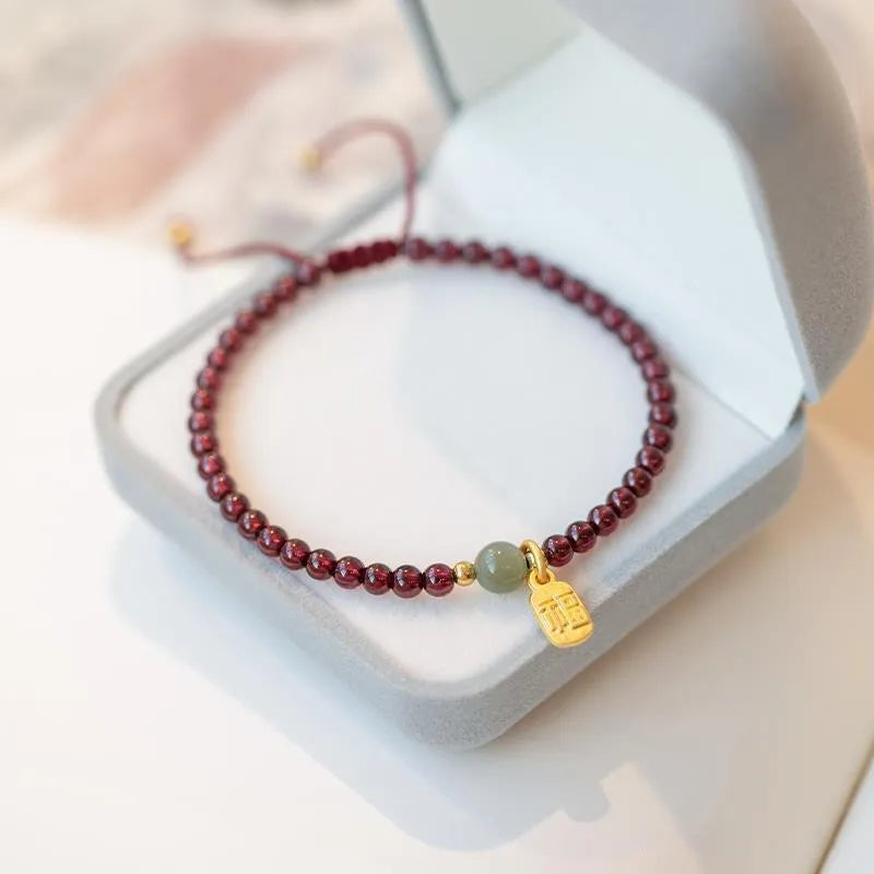 Hand-woven red rope bracelet with strawberry quartz crystals for women