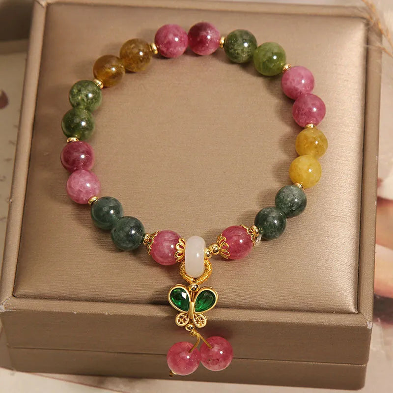 Women's tourmaline bracelet with colourful butterfly pendant and rhinestone detailing on adjustable chain
