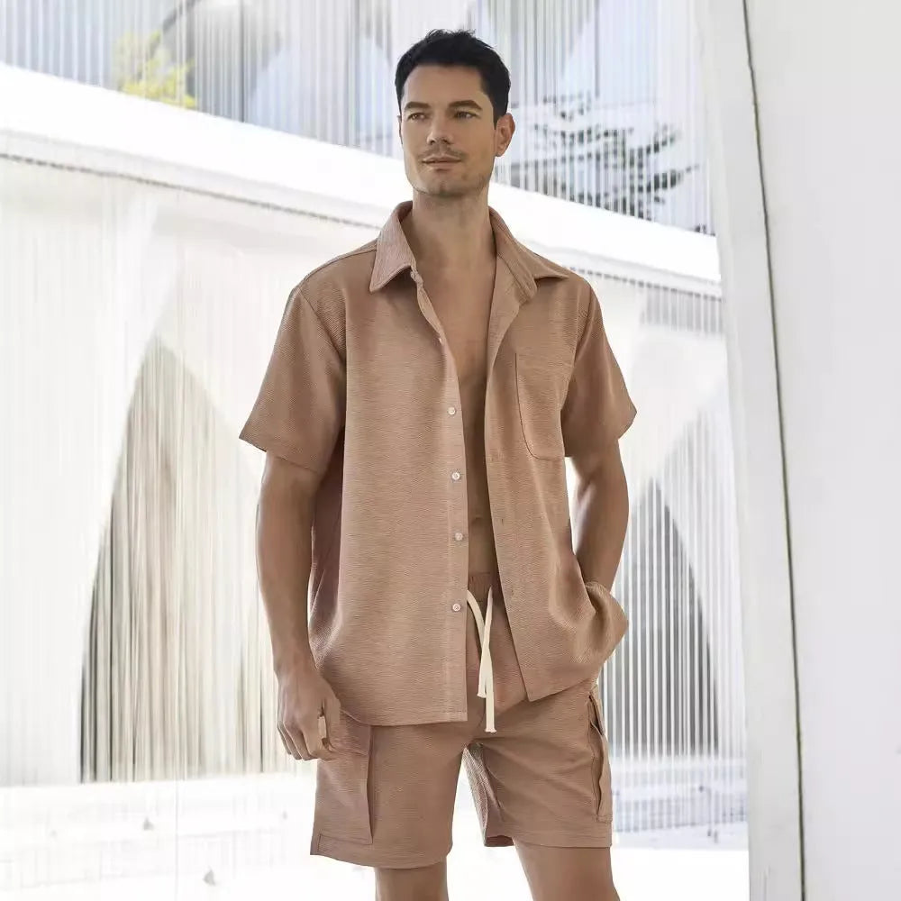 A woman's two-piece co-ord set with a short sleeve top and elastic waist shorts in a neutral colour.