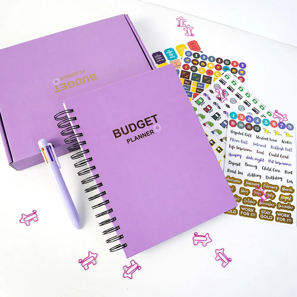 Purple A4 coil notebook for financial planning with stickers, pen, and paper clips