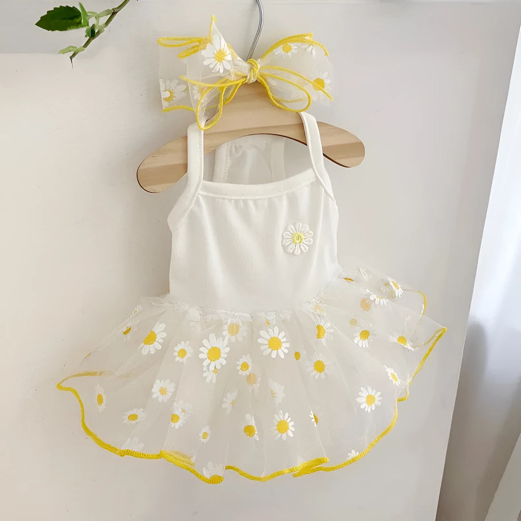 Yellow daisy pattern dog clothes on pet model showing thin polyester summer construction