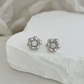 S925 sterling silver black agate flower ear studs in gold colour close up
