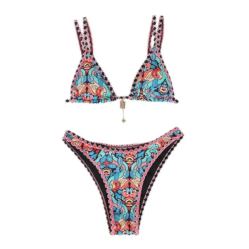 Women's retro-style printed swim bikini set in orange, pink, black, and blue colours on a mannequin.