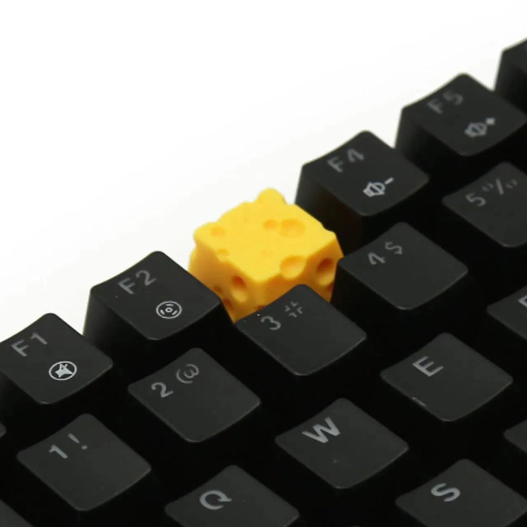 Yellow resin cheese keycap for mechanical keyboards with 3D design detail