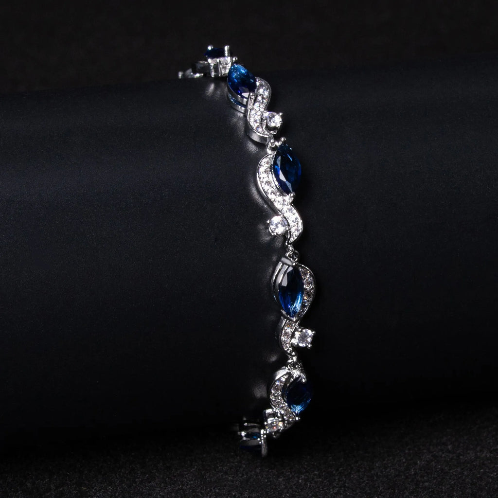 Zircon line bracelet in copper with geometric inlaid design, shown in blue or white for women