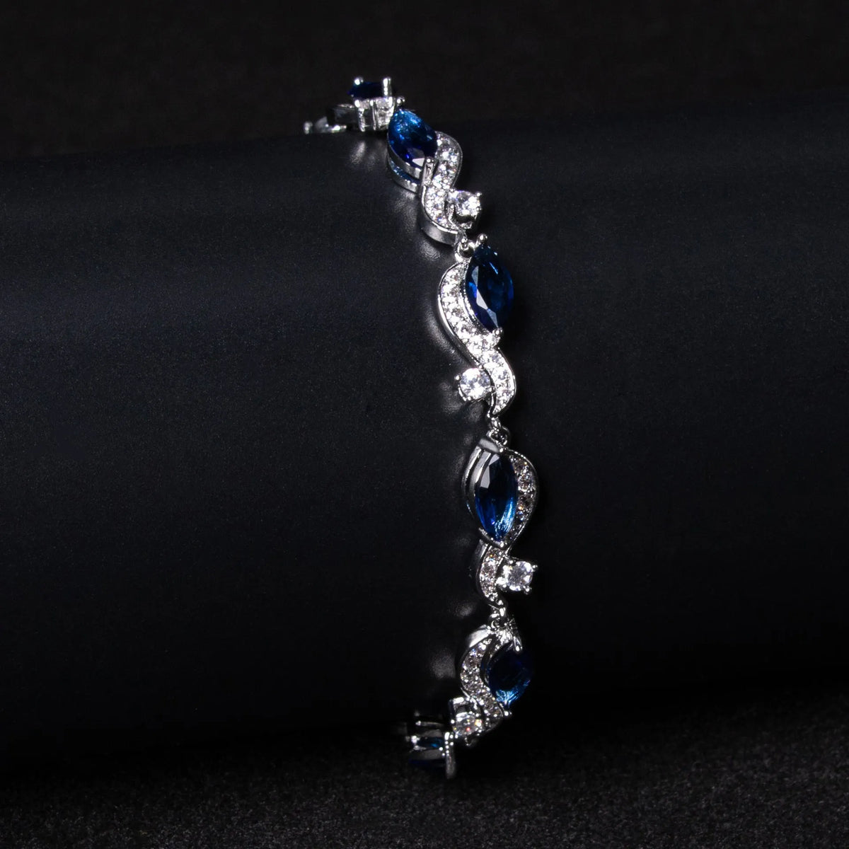Zircon line bracelet in copper with geometric inlaid design, shown in blue or white for women