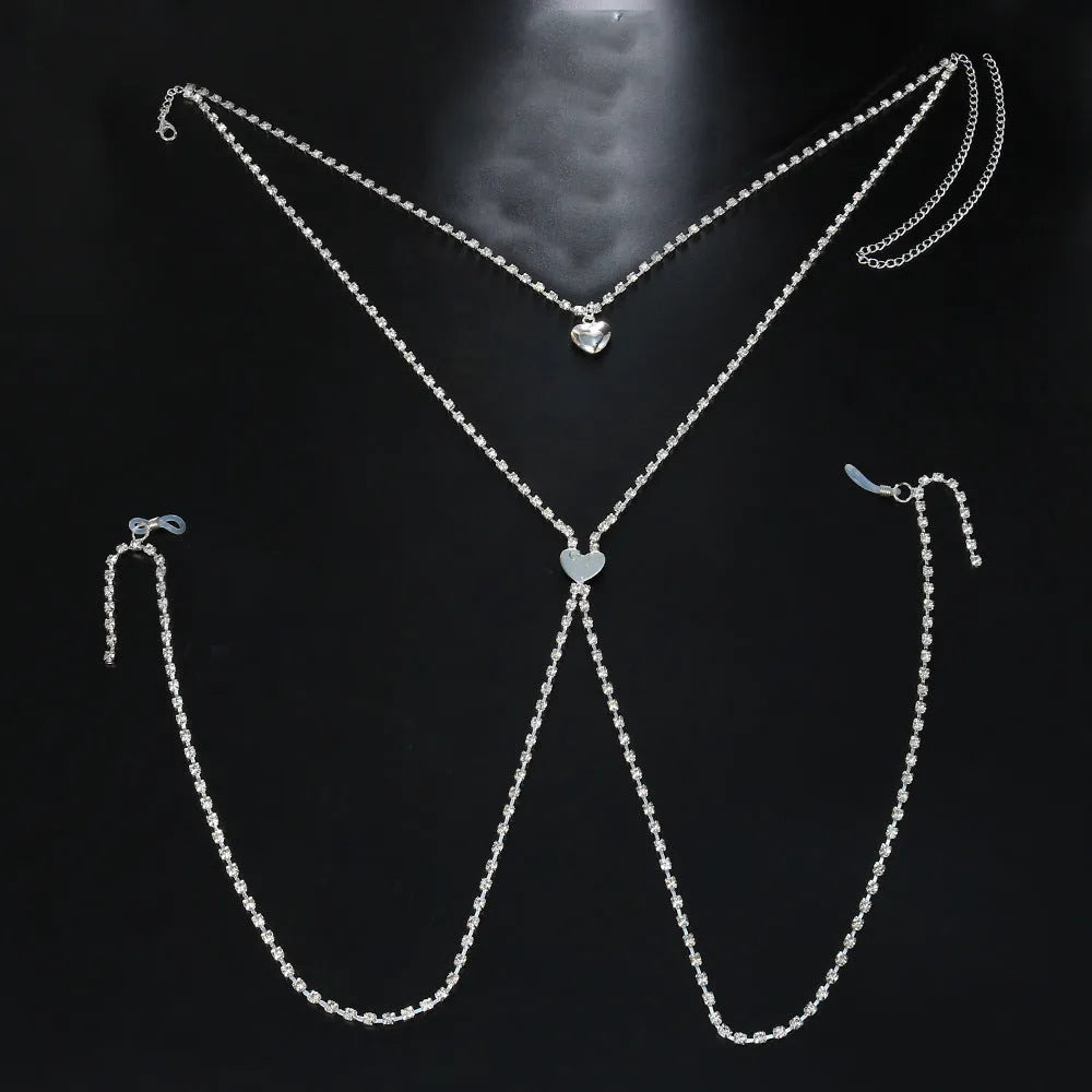 Gold or silver coloured heart-shaped body chain for women with rhinestone detailing.