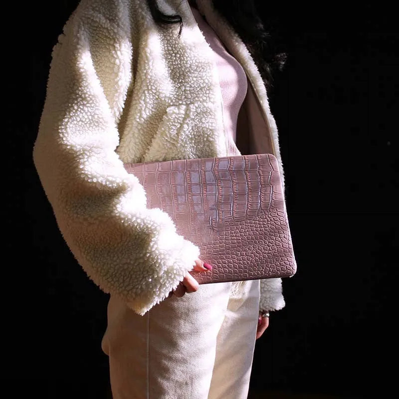 Pink MacBook protective case with bubble pattern and colourful stickers, compatible with 11-inch to 16-inch models.