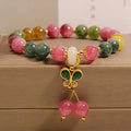 Women's tourmaline bracelet with colourful butterfly pendant and rhinestone detailing on adjustable chain