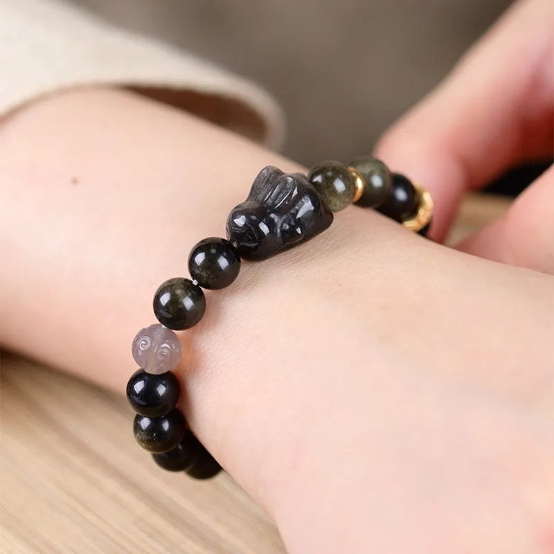 Handmade Chinese national style obsidian bracelet with lying rabbit charm and mixed metal and agate beads.