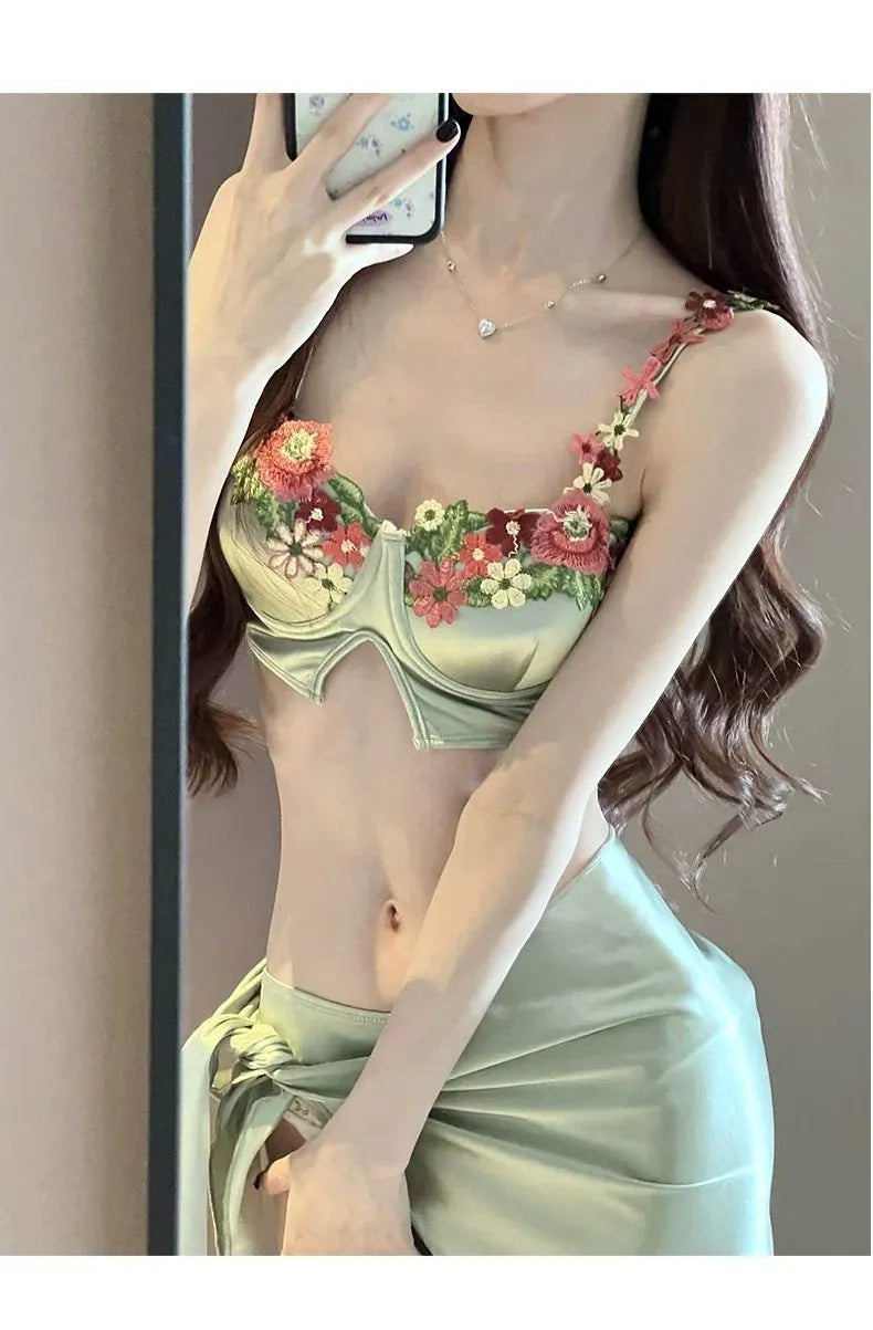 Green women's triangle bikini three-piece set with skirt on Asian size mannequin
