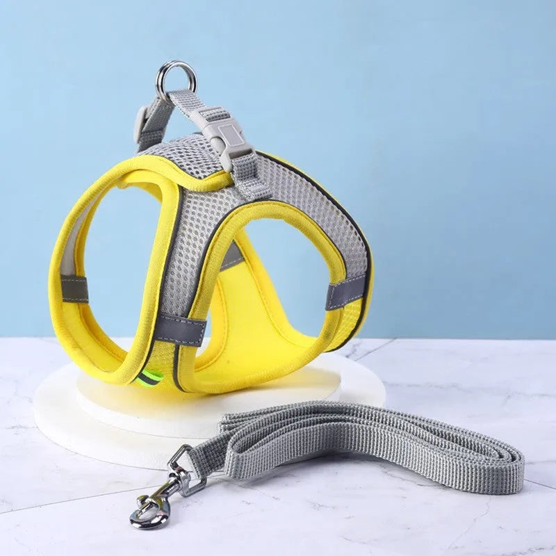Reflective vest-style dog harness in breathable polyester with adjustable straps and rope leash