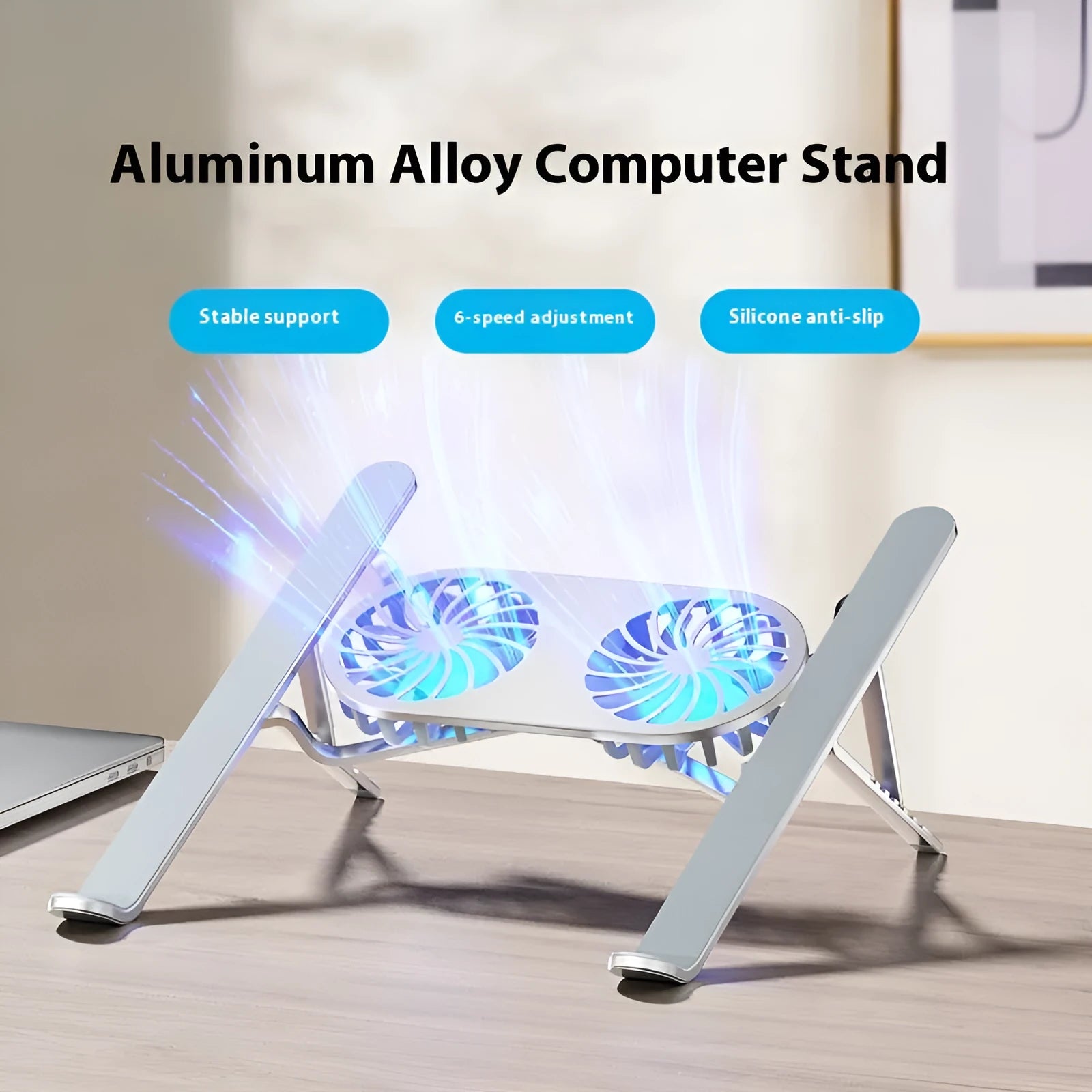 Silver aluminium laptop stand with twin cooling fans in folded position beside cloth storage bag