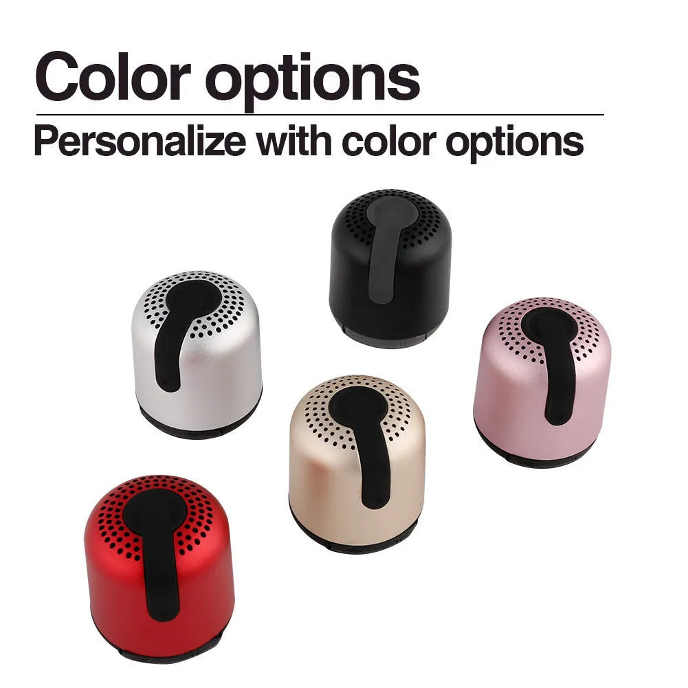 Hieha XQ11 cylindrical metal waterproof Bluetooth speaker in silver colour on a table