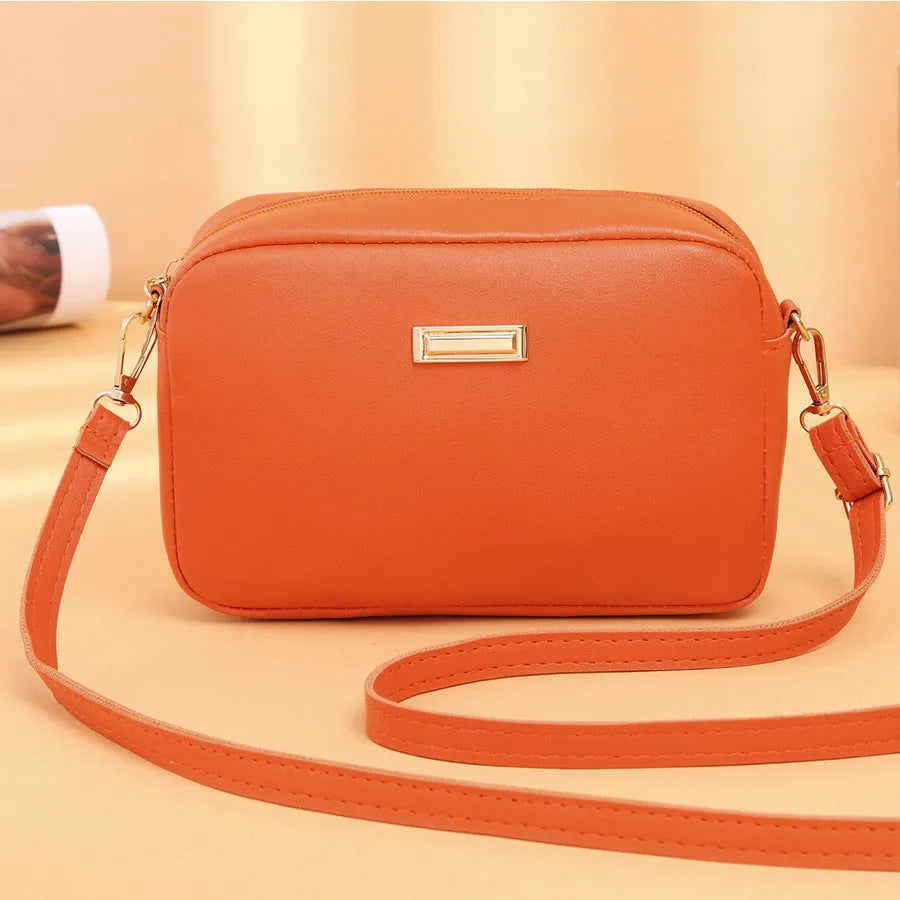Solid colour minimalist ladies shoulder bag in PU leather with a three-dimensional pocket