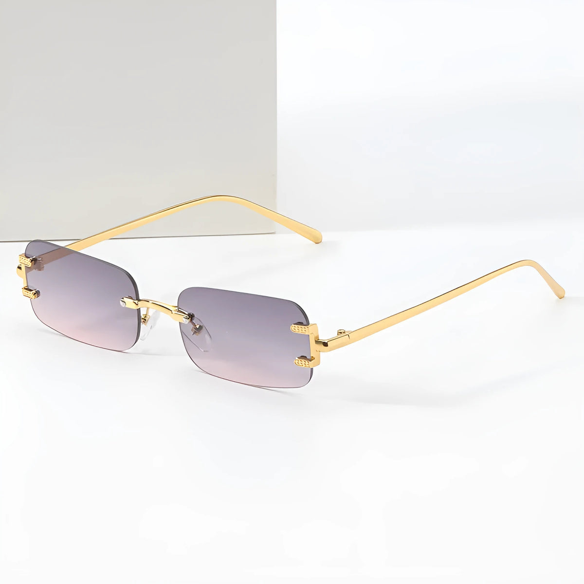 Retro square frameless sunglasses with gold metal frame and black/gray AC lenses
