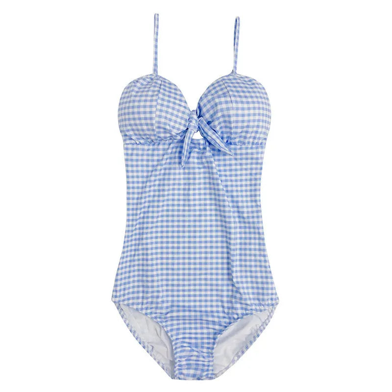 Blue and white plaid one-piece swimsuit for women on a hanger.